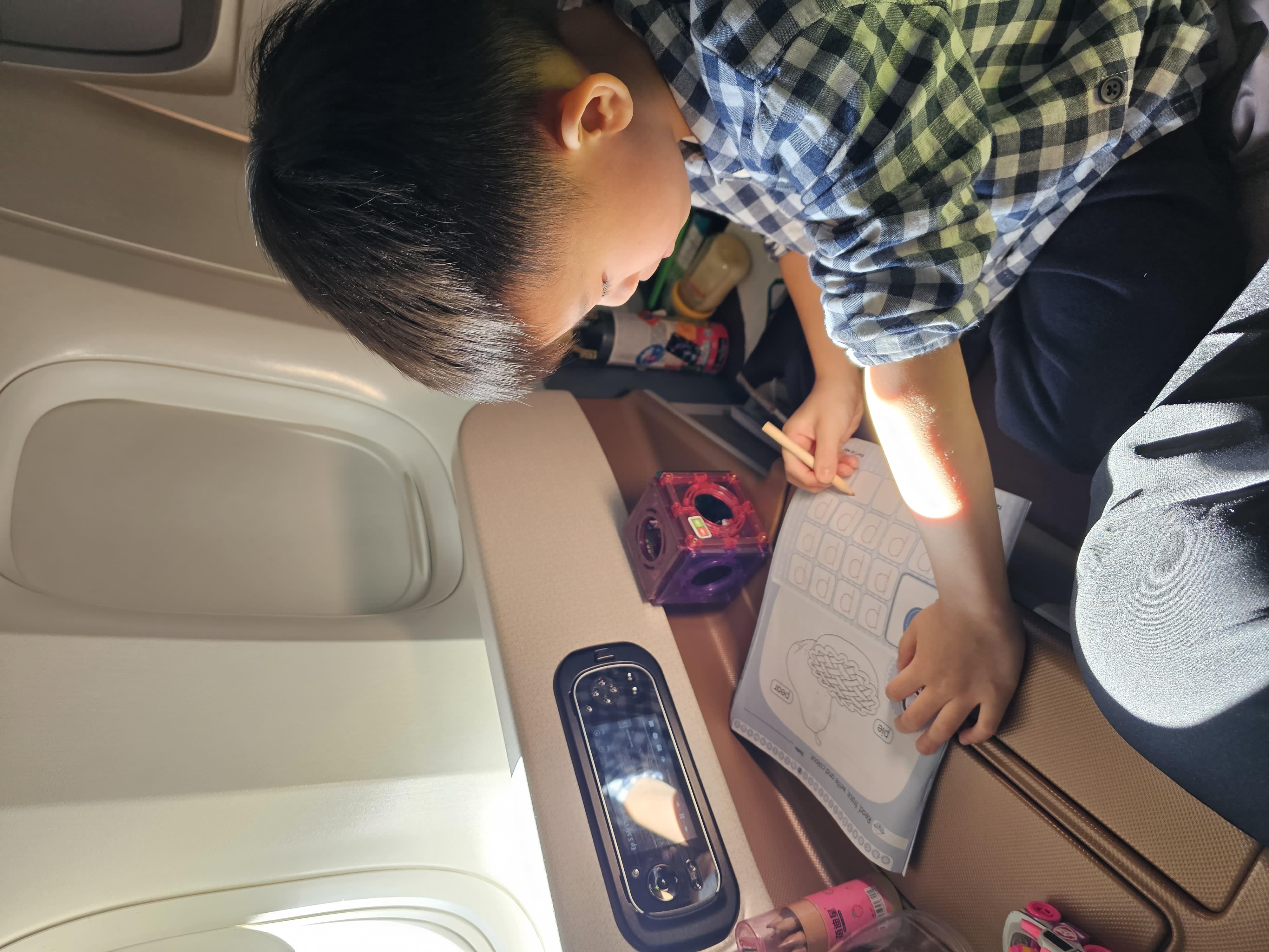 Singapore Airline Business Class seat are spacious enough for them to walk around and do the activities i brought on board